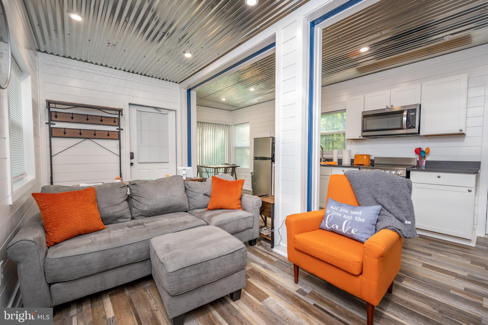 2195 Glendale Road Swanton, MD 21561 - Photo 9 of 35 a living room with furniture and a flat screen tv
