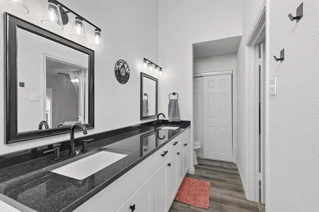 a bedroom with a bed and ceiling fan