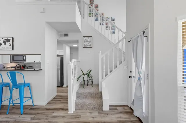 a view of entryway and hall with a dining room