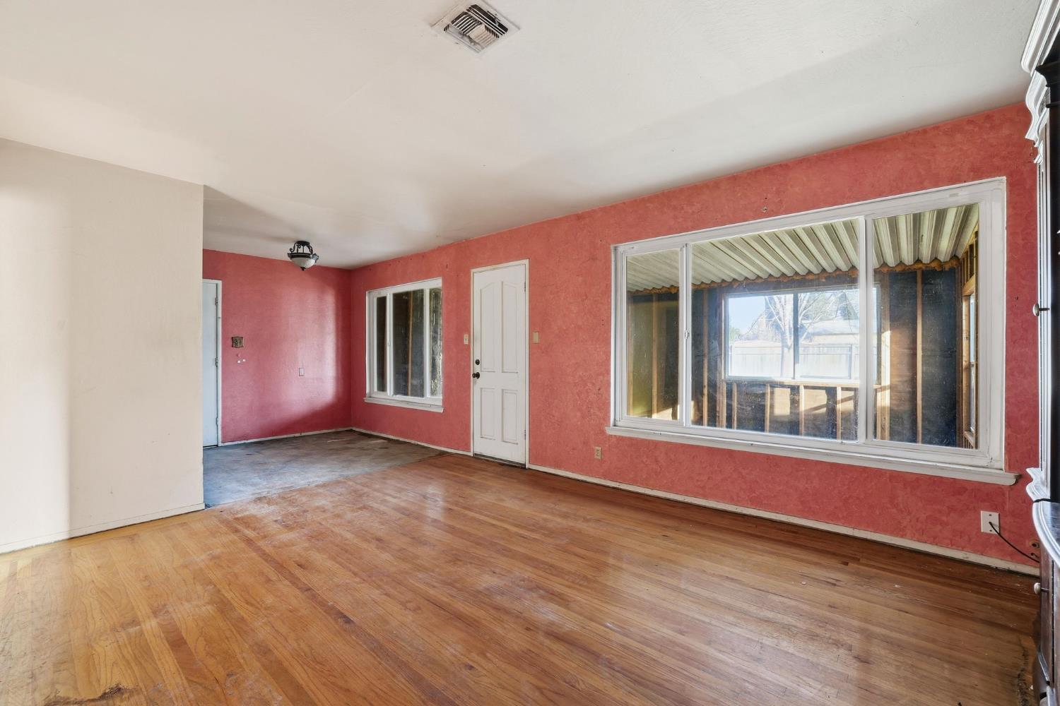 5674 Rio Verde Way North Highlands, CA 95660 - Photo 11 of 35 a view of an empty room with wooden floor and a window