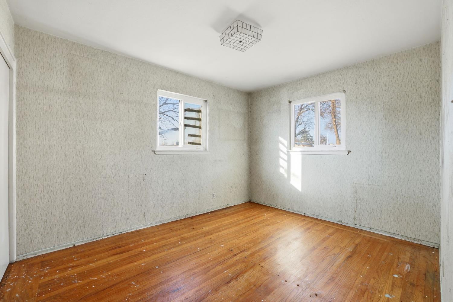 5674 Rio Verde Way North Highlands, CA 95660 - Photo 14 of 35 wooden floor in an empty room with a window