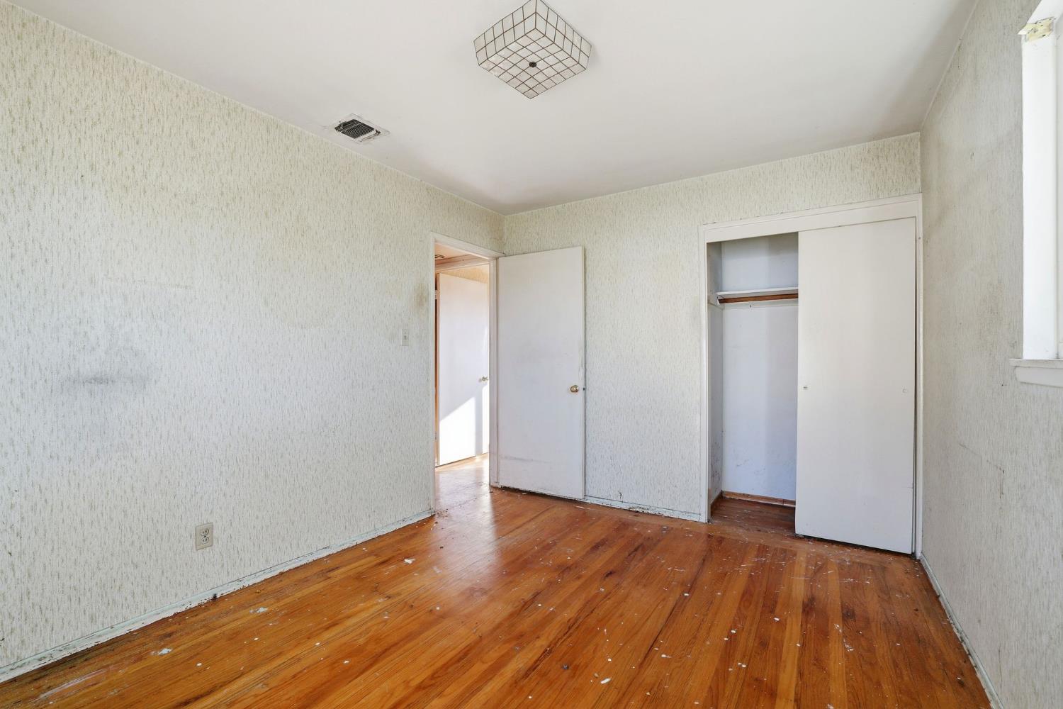 5674 Rio Verde Way North Highlands, CA 95660 - Photo 15 of 35 a view of an empty room with wooden floor