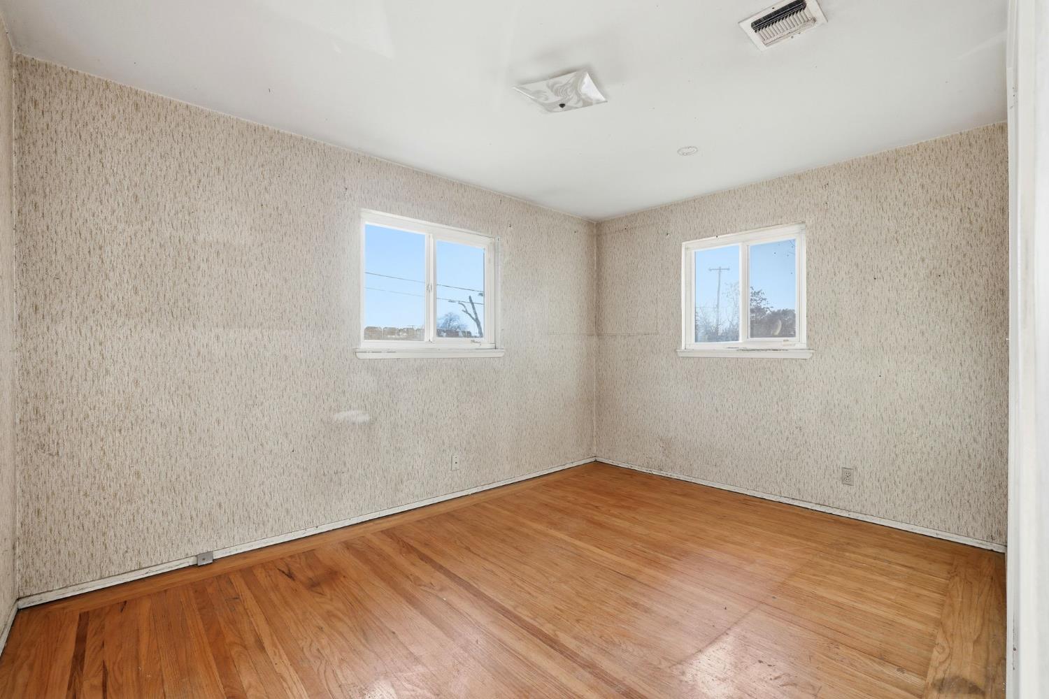 5674 Rio Verde Way North Highlands, CA 95660 - Photo 16 of 35 a view of empty room with wooden floor and fan