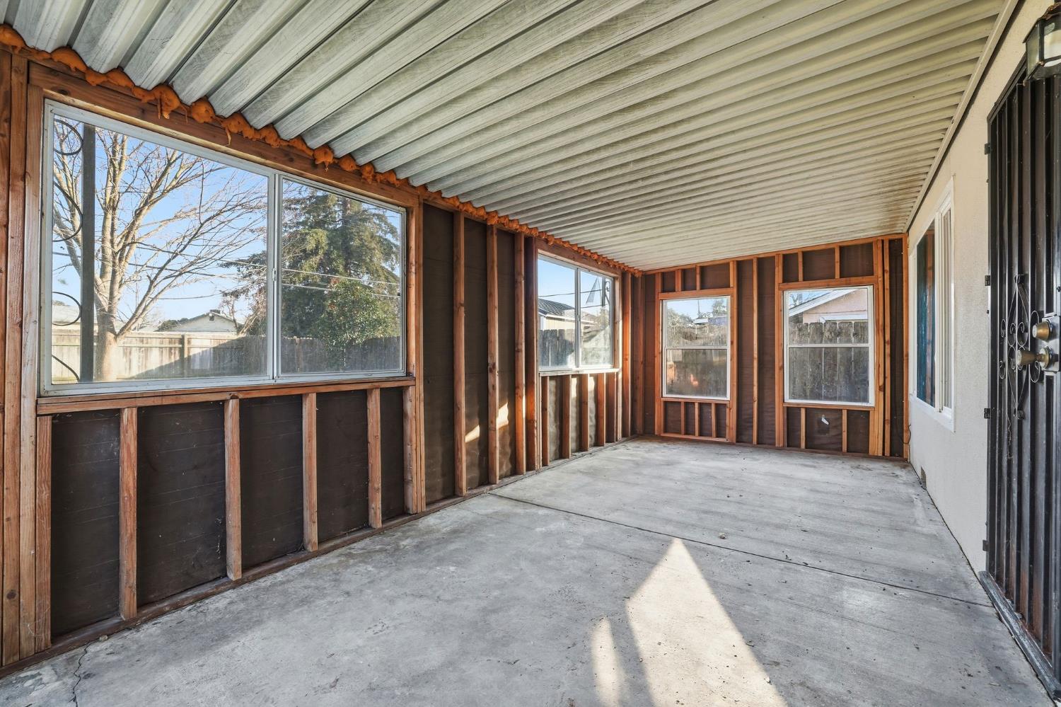 5674 Rio Verde Way North Highlands, CA 95660 - Photo 21 of 35 a view of a porch with wooden floor and roof