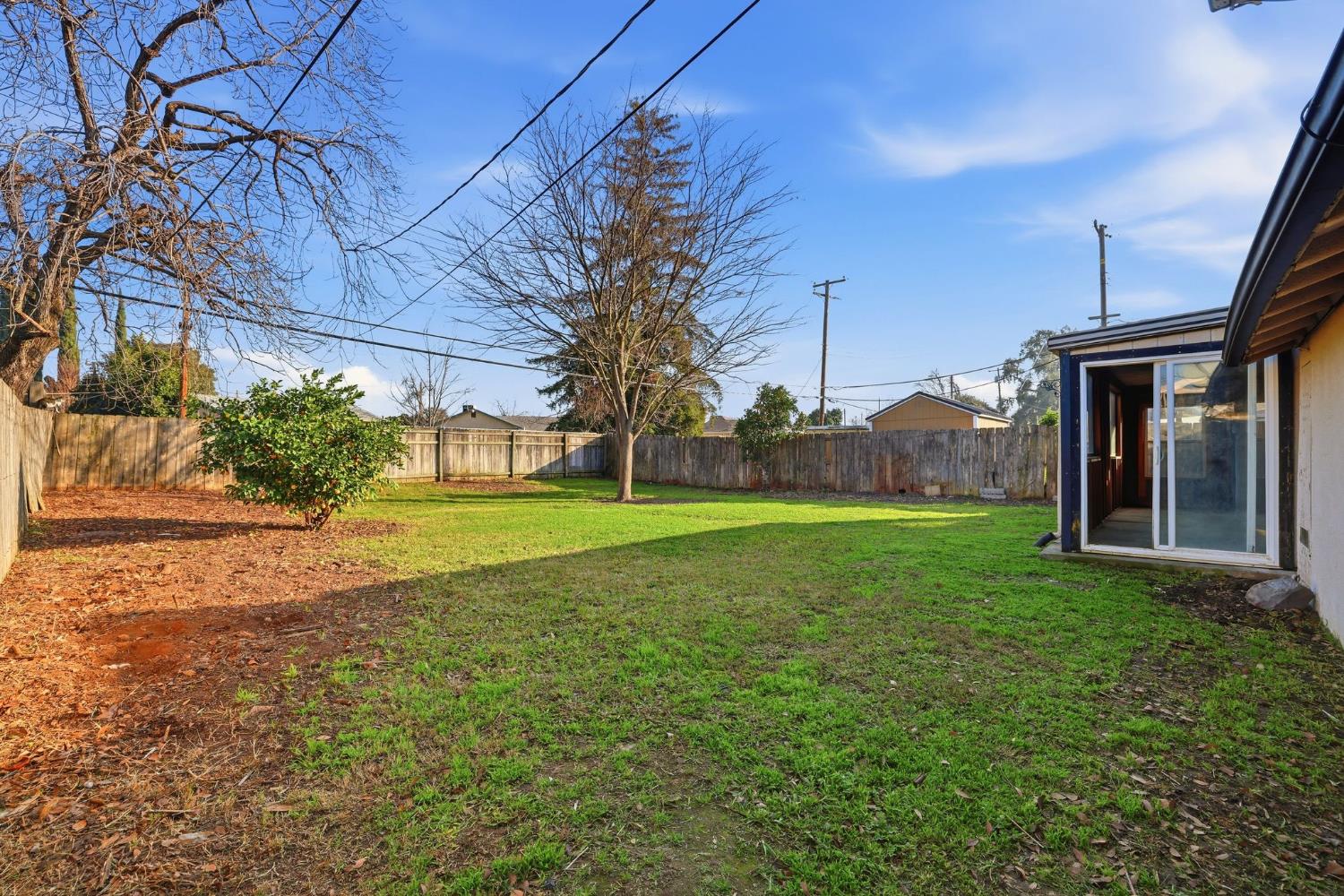 5674 Rio Verde Way North Highlands, CA 95660 - Photo 22 of 35 a view of a house with a backyard