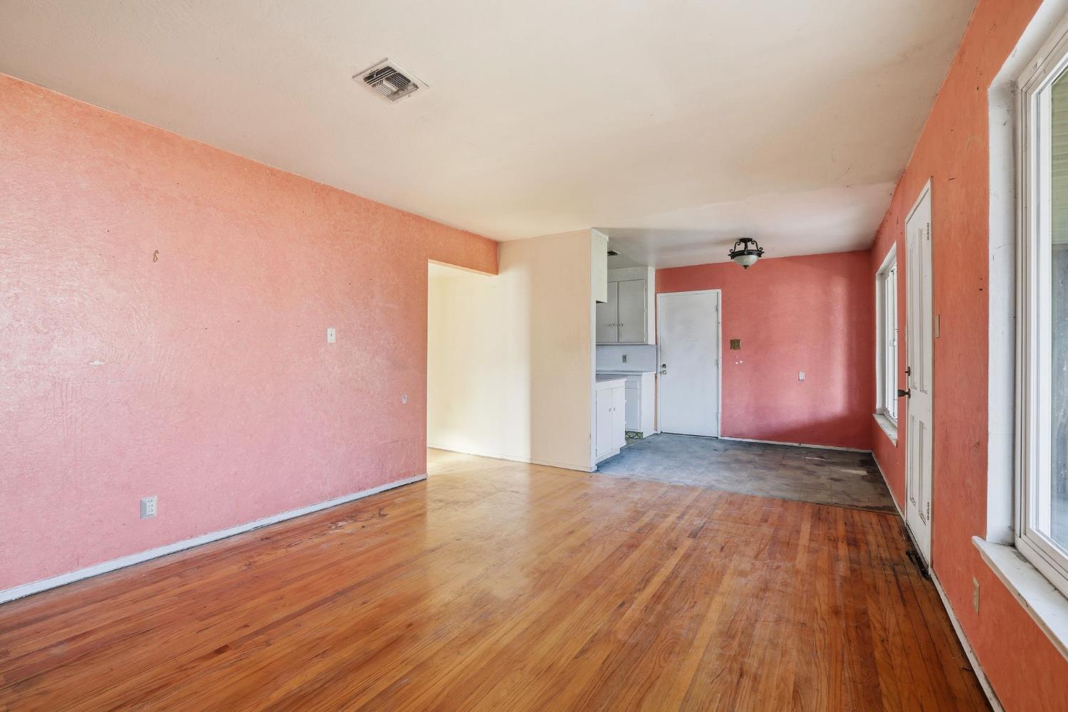 5674 Rio Verde Way North Highlands, CA 95660 - Photo 4 of 35 a view of an empty room with wooden floor and a window