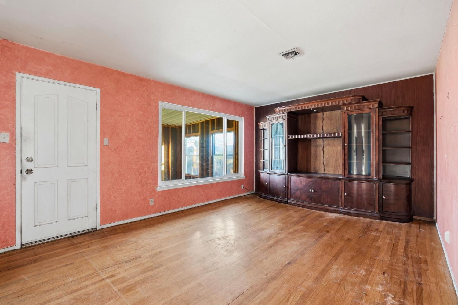 5674 Rio Verde Way North Highlands, CA 95660 - Photo 7 of 35 a view of empty room with window and wooden floor