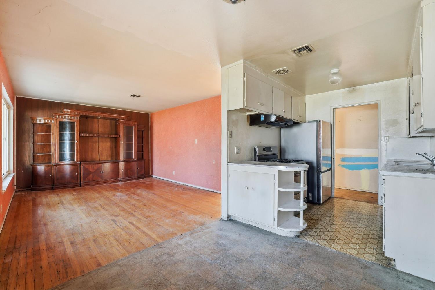 5674 Rio Verde Way North Highlands, CA 95660 - Photo 8 of 35 a kitchen with a refrigerator and a stove top oven