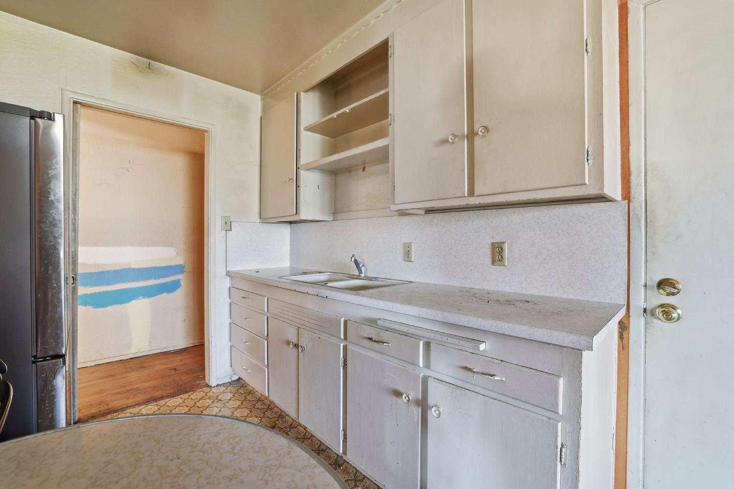 5674 Rio Verde Way North Highlands, CA 95660 - Photo 10 of 35 a kitchen with stainless steel appliances granite countertop a sink stove and cabinets
