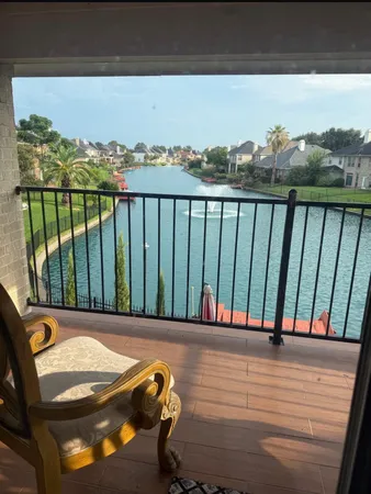 a view of a balcony with furniture