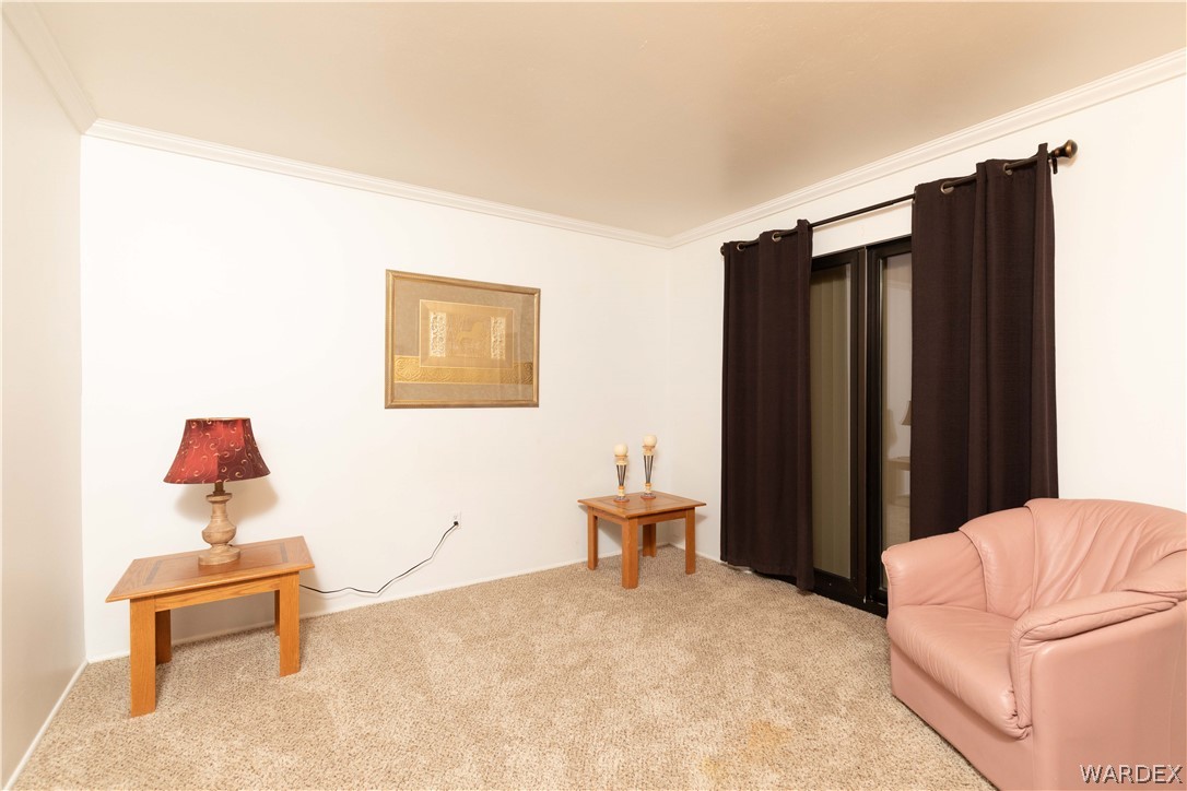 4214 Bluff Road Golden Valley, AZ 86413 - Photo 16 of 46 a bedroom with a bed and a chair
