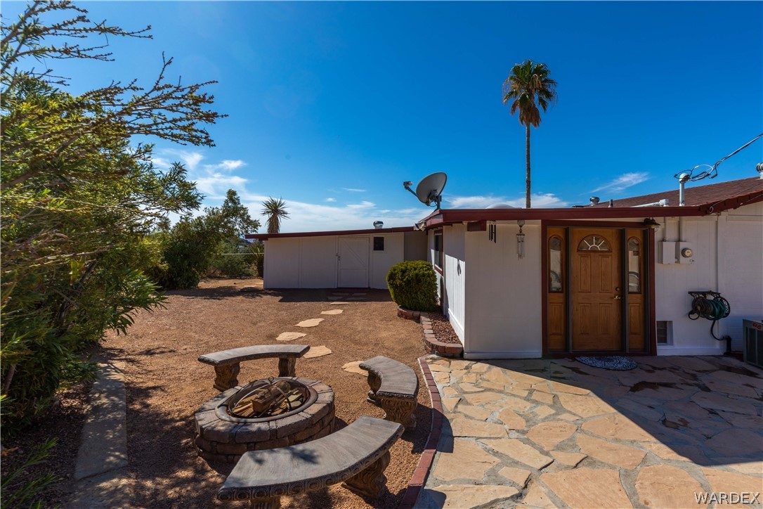 4214 Bluff Road Golden Valley, AZ 86413 - Photo 32 of 46 a table and chairs in a patio