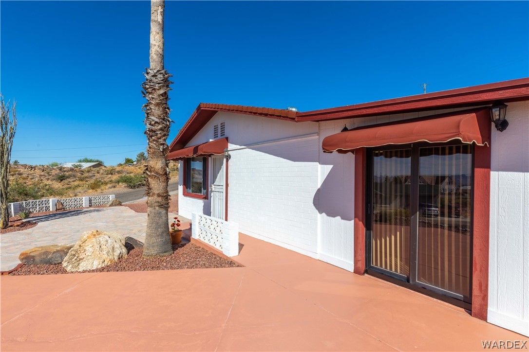 4214 Bluff Road Golden Valley, AZ 86413 - Photo 36 of 46 a front view of a house with a yard