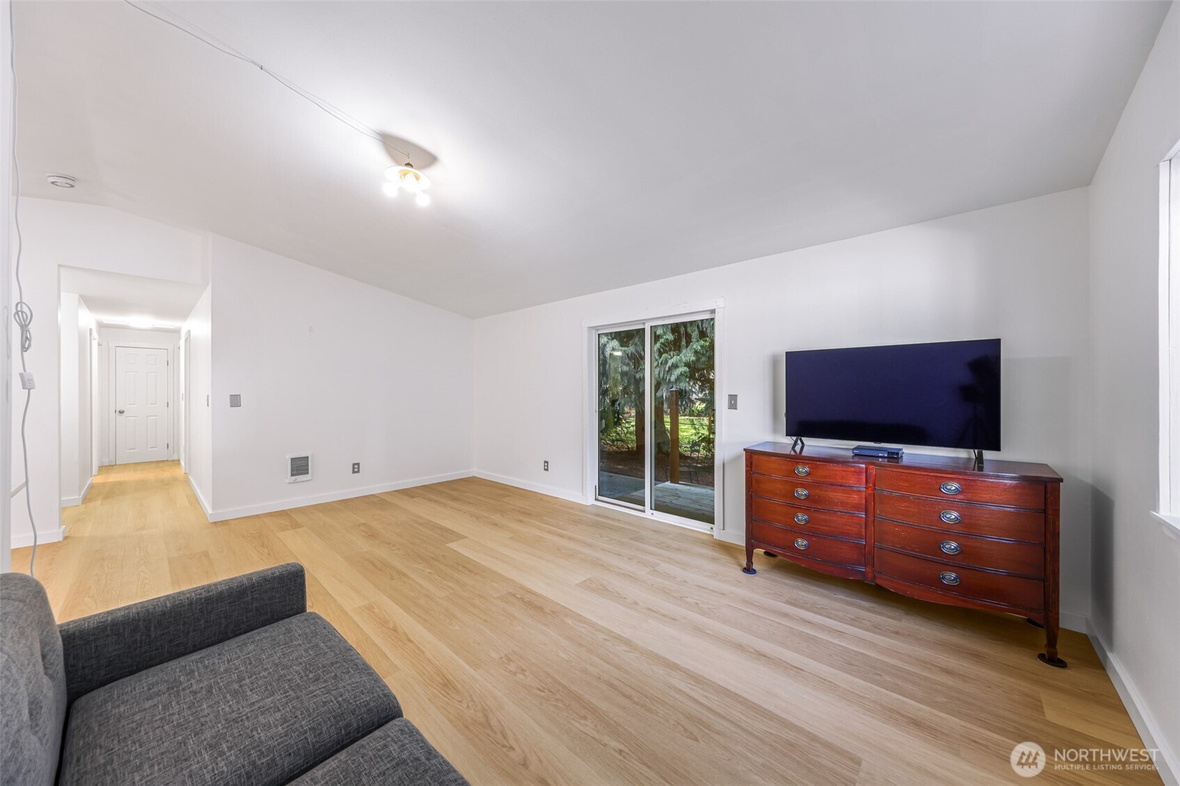 439 Fir Lane Sedro-Woolley, WA 98284 - Photo 13 of 29 a bedroom with furniture and a flat screen tv