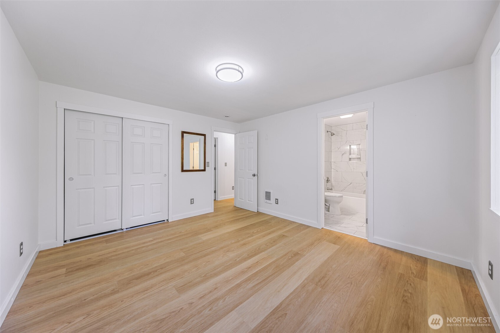439 Fir Lane Sedro-Woolley, WA 98284 - Photo 16 of 29 a view of an empty room with wooden floor