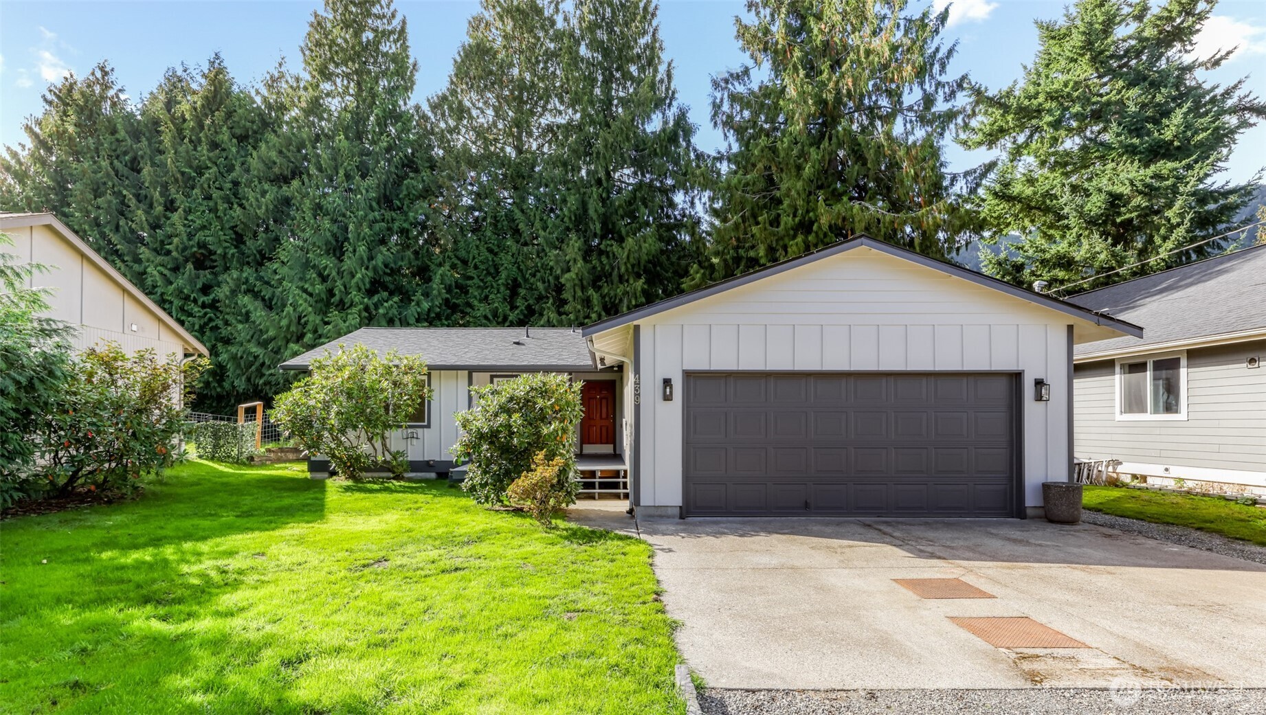 439 Fir Lane Sedro-Woolley, WA 98284 - Photo 2 of 29 a front view of a house with a yard and garage
