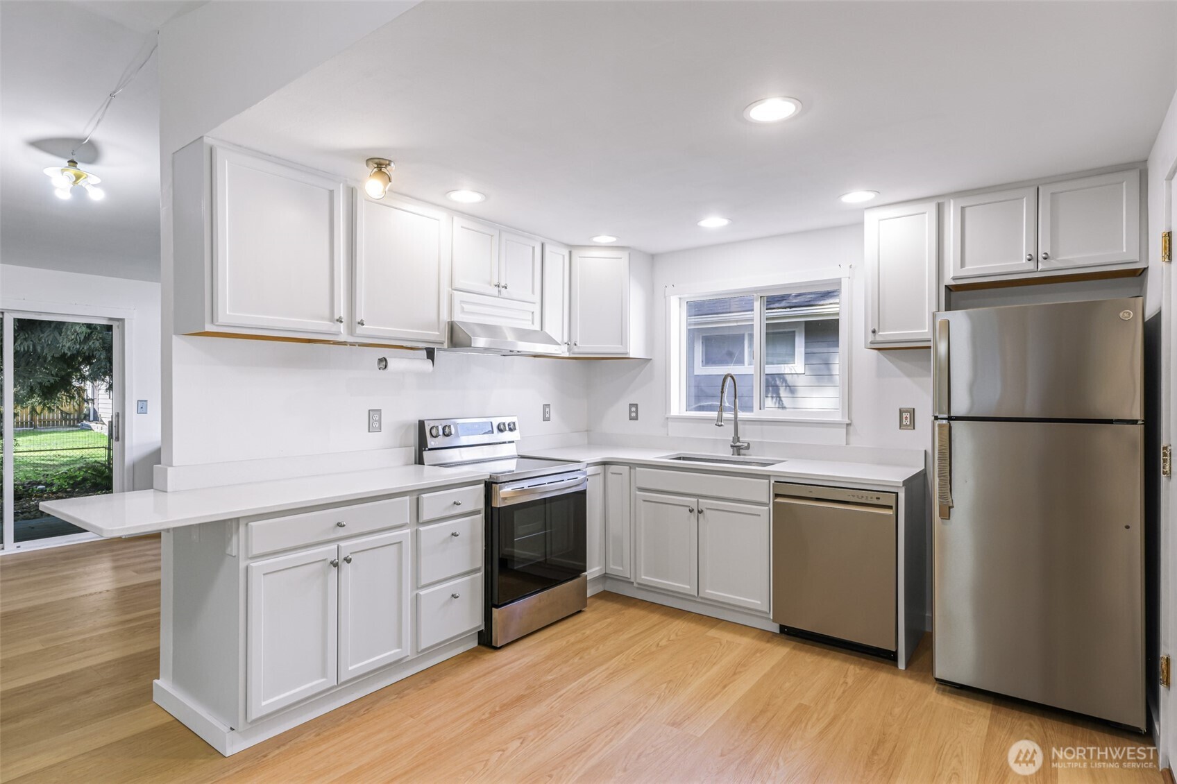 439 Fir Lane Sedro-Woolley, WA 98284 - Photo 7 of 29 a kitchen with stainless steel appliances granite countertop a sink stove and refrigerator