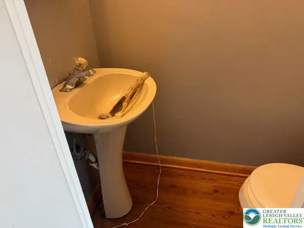 a bathroom with a sink and mirror