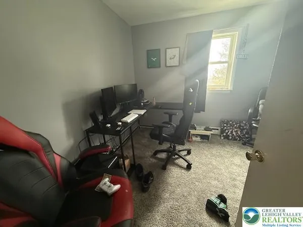 a workspace with furniture and a window