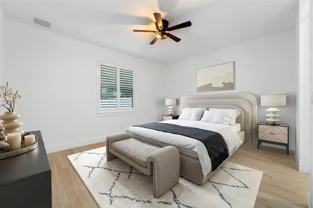 a bedroom with a bed and a couch