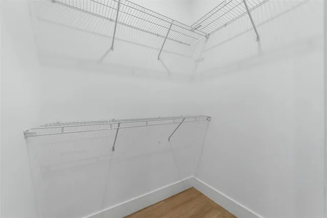 a view of a room with racks on the wall
