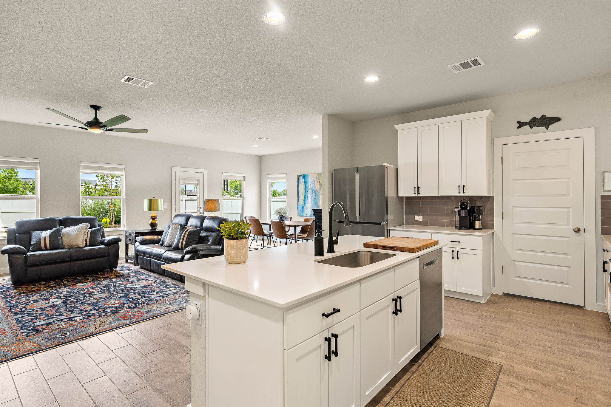 234 Appleberry Lane Elgin, TX 78621 - Photo 13 of 28 The open layout keeps the kitchen, living, and dining areas connected while still feeling comfortable and practical.