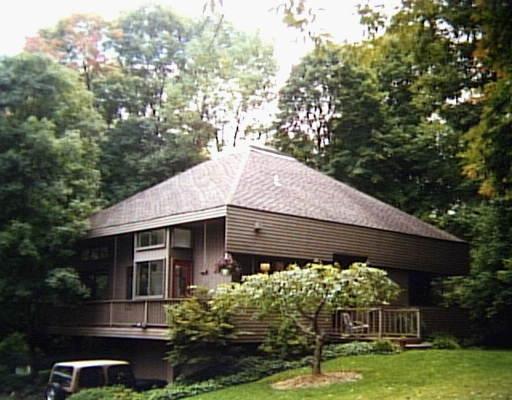 348 Ridgefield Road Wilton, CT 06897 - Photo 1 of 1 a front view of a house with garden