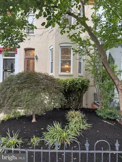 a view of a house with a tree