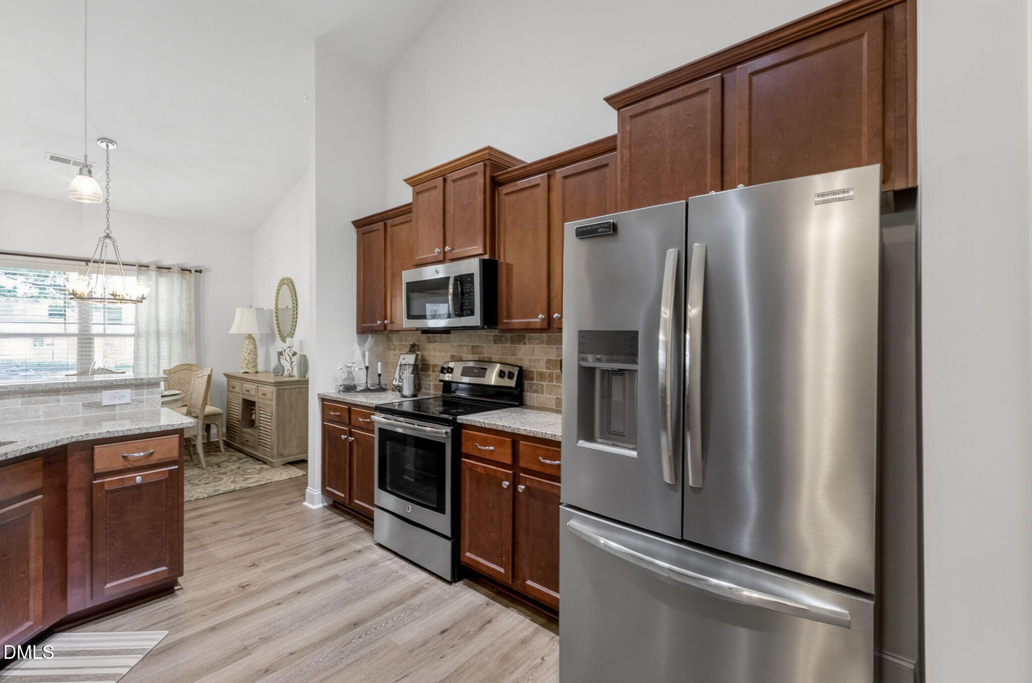20 Deep Clay Circle Angier, NC 27501 - Photo 22 of 54 a kitchen with stainless steel appliances a refrigerator stove and sink