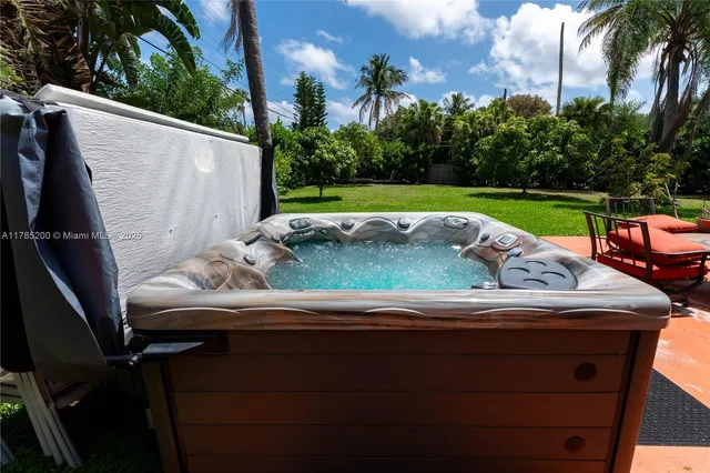 a view of outdoor sitting area with furniture and garden