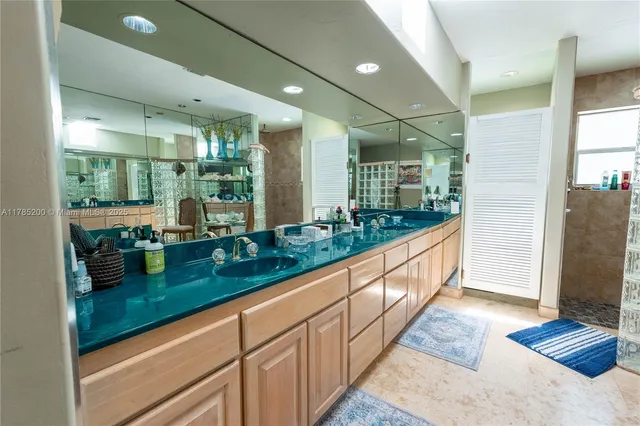 an open kitchen with granite countertop kitchen island and stainless steel appliances