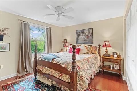 a bedroom with a bed and a table in it
