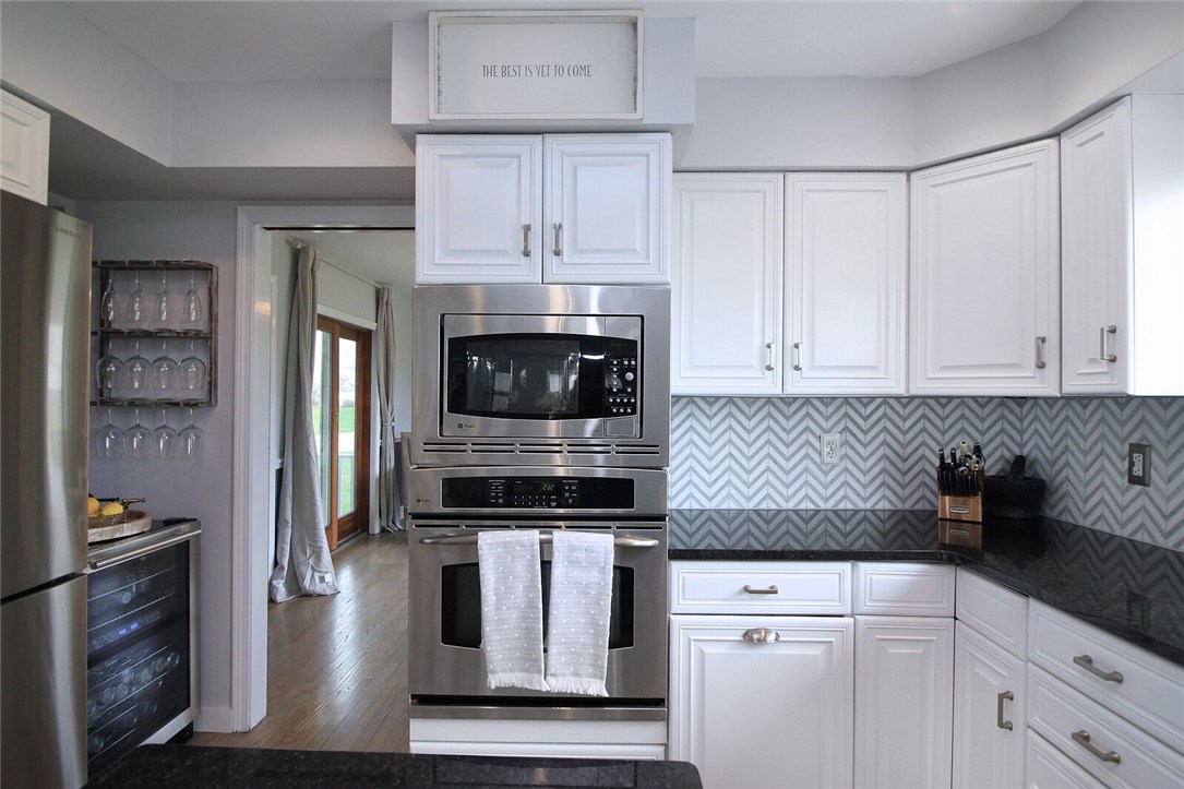 74 Sisson Pond Road Portsmouth, RI 02871 - Photo 8 of 39 Living area leads into the updated kitchen.