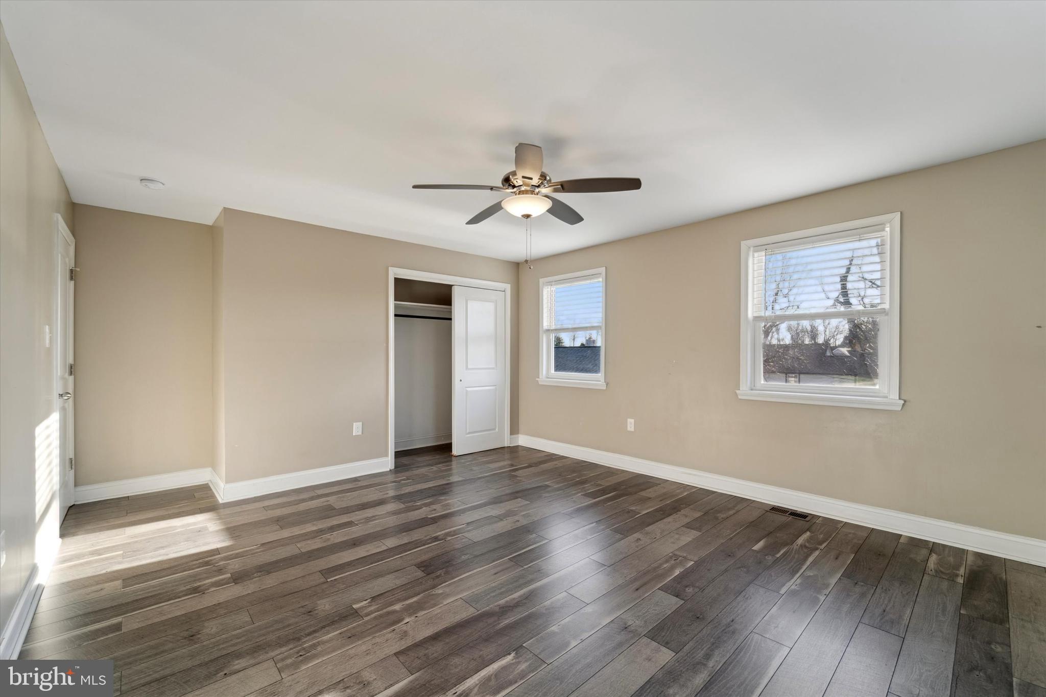 341 Date Street Warminster, PA 18974 - Photo 19 of 33 a view of an empty room with window and wooden floor
