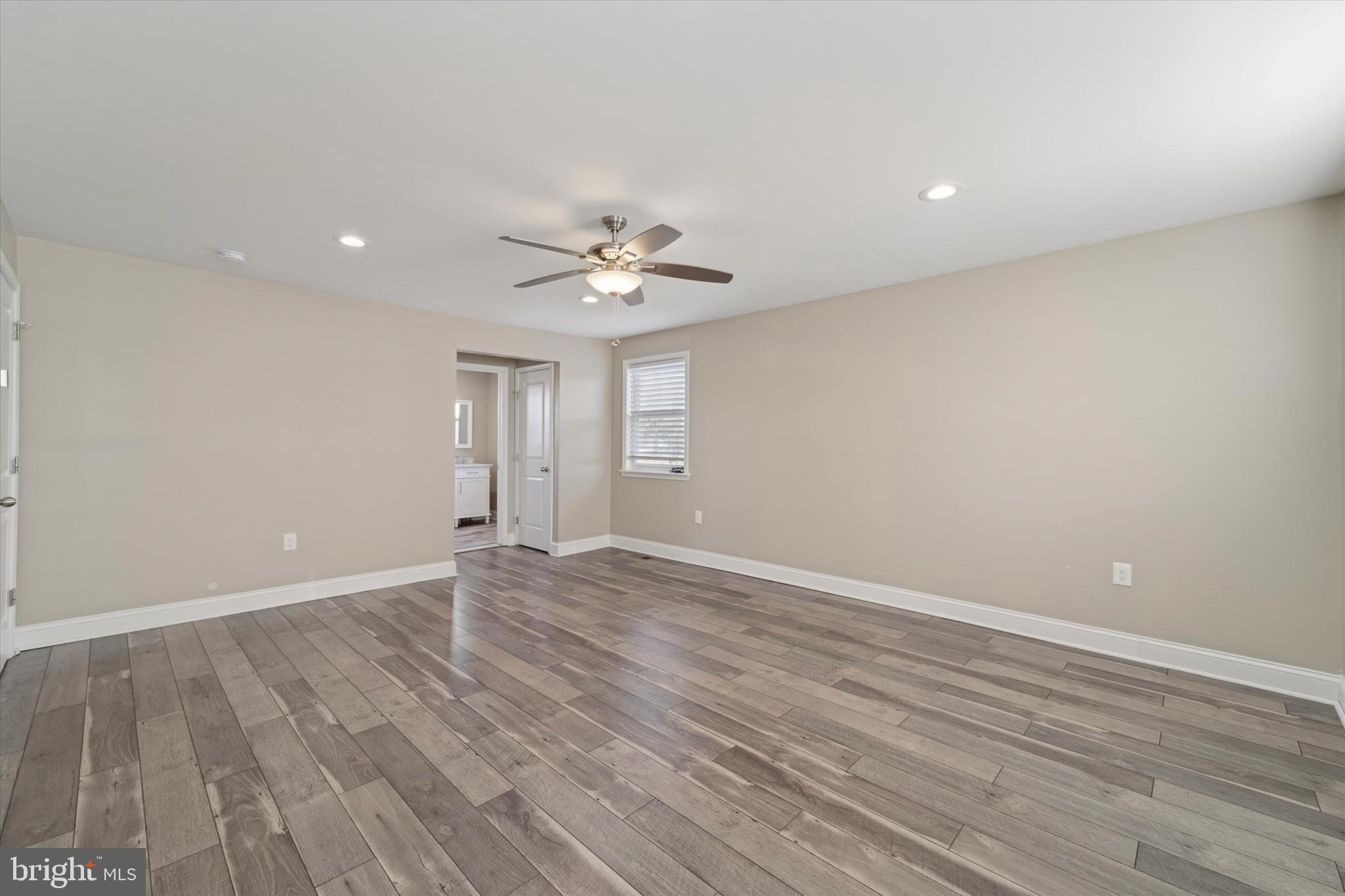 341 Date Street Warminster, PA 18974 - Photo 26 of 33 a view of an empty room with wooden floor and a ceiling fan