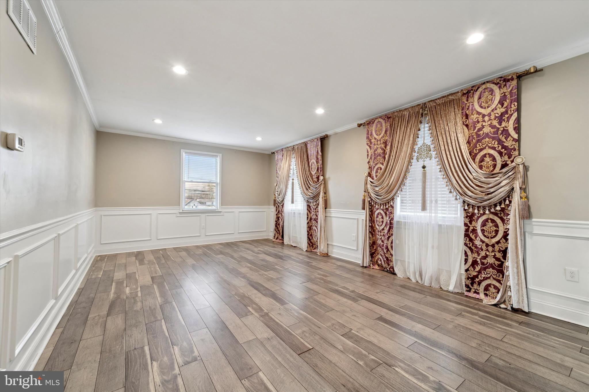 341 Date Street Warminster, PA 18974 - Photo 10 of 33 a view of an empty room with wooden floor and a window