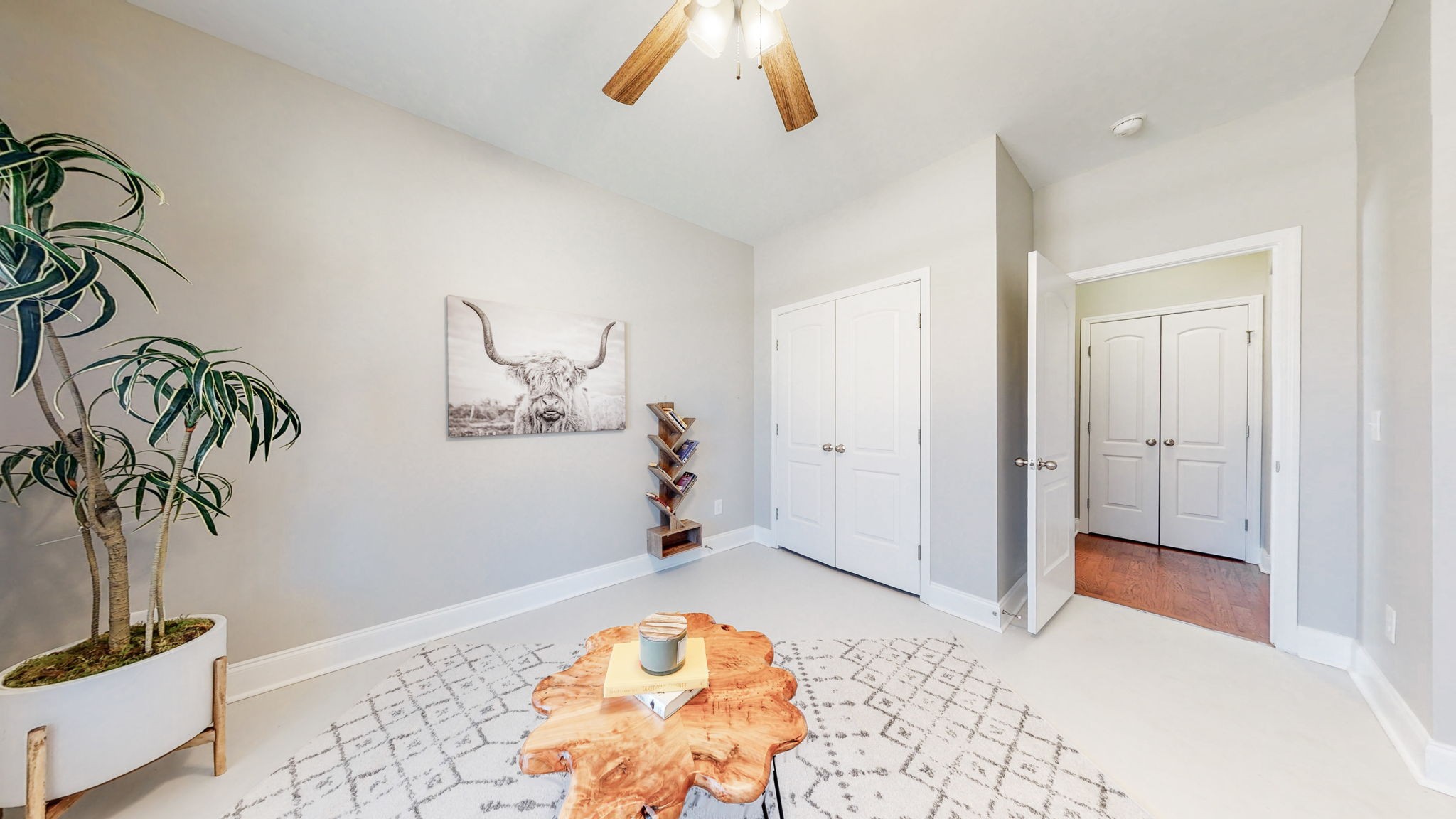 123 Monarchos Drive Gallatin, TN 37066 - Photo 19 of 55 a bedroom with a bed and a potted plant