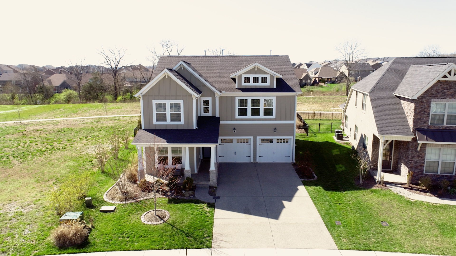 123 Monarchos Drive Gallatin, TN 37066 - Photo 2 of 55 a front view of a house with garden