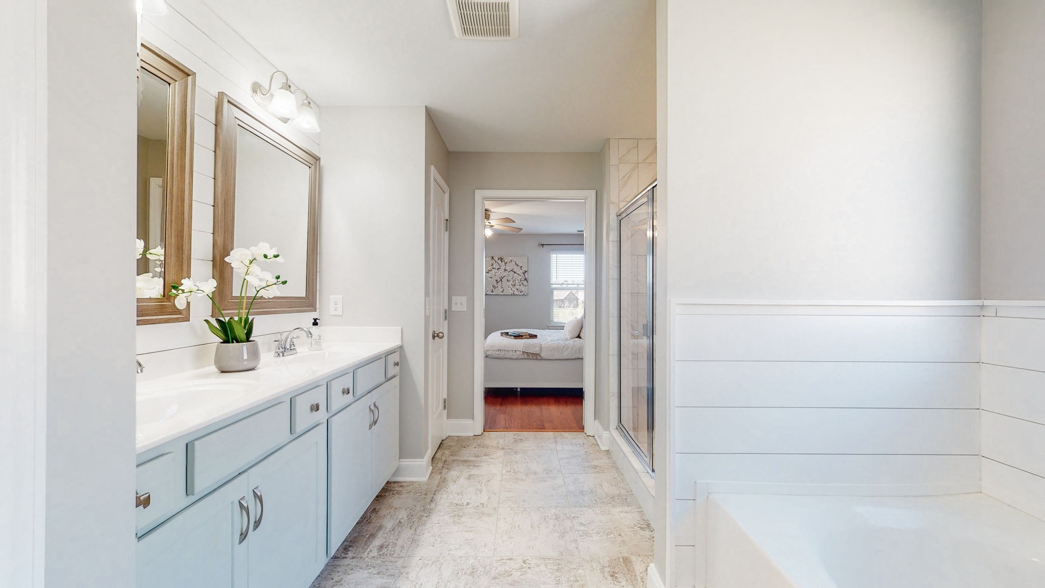 123 Monarchos Drive Gallatin, TN 37066 - Photo 29 of 55 a en suite bathroom with a granite countertop sink mirror and a bathtub