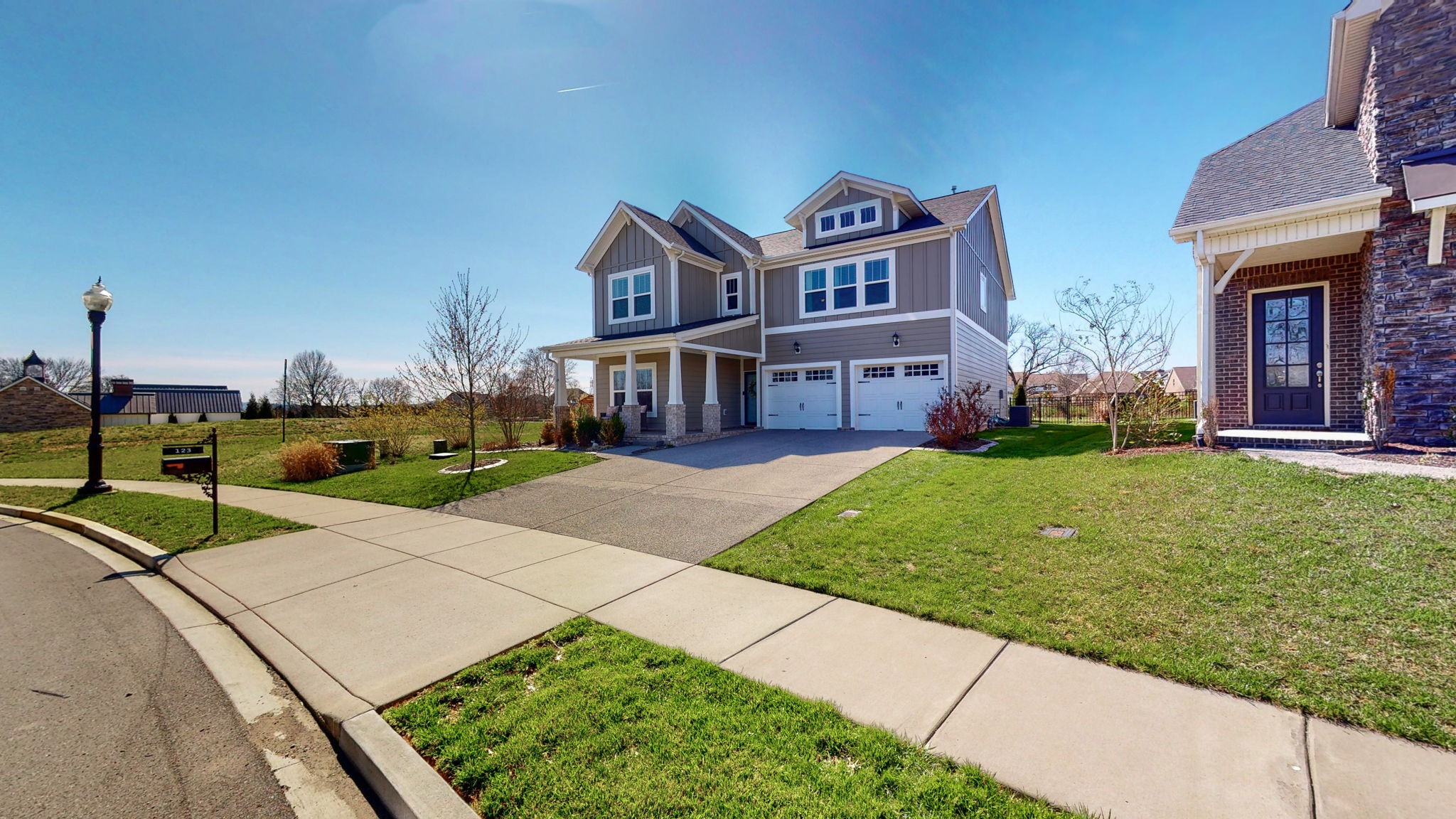 123 Monarchos Drive Gallatin, TN 37066 - Photo 3 of 55 a front view of a house with garden
