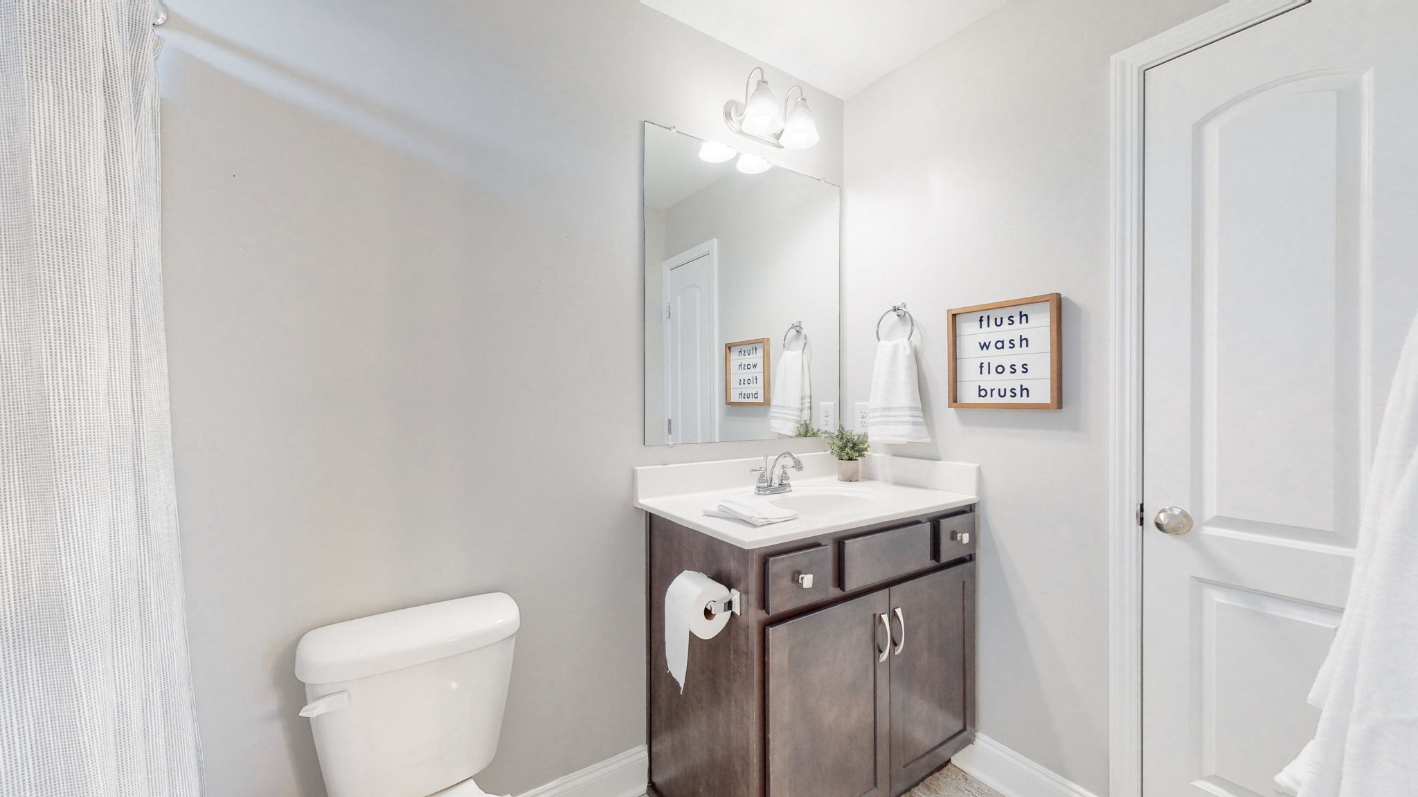 123 Monarchos Drive Gallatin, TN 37066 - Photo 33 of 55 a bathroom with a toilet a sink a mirror and vanity