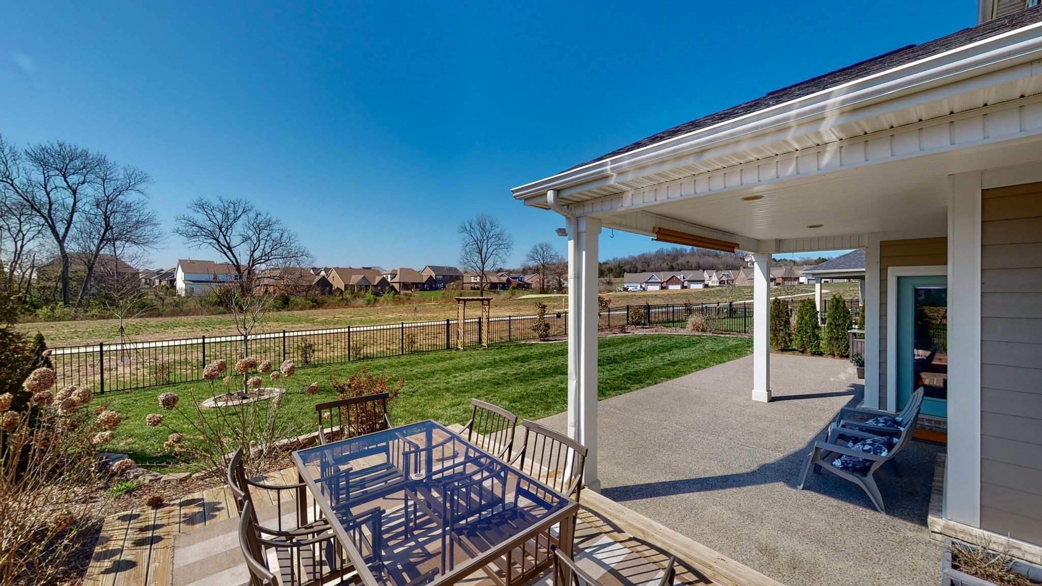 123 Monarchos Drive Gallatin, TN 37066 - Photo 47 of 55 a view of a chairs and table in patio with a yard