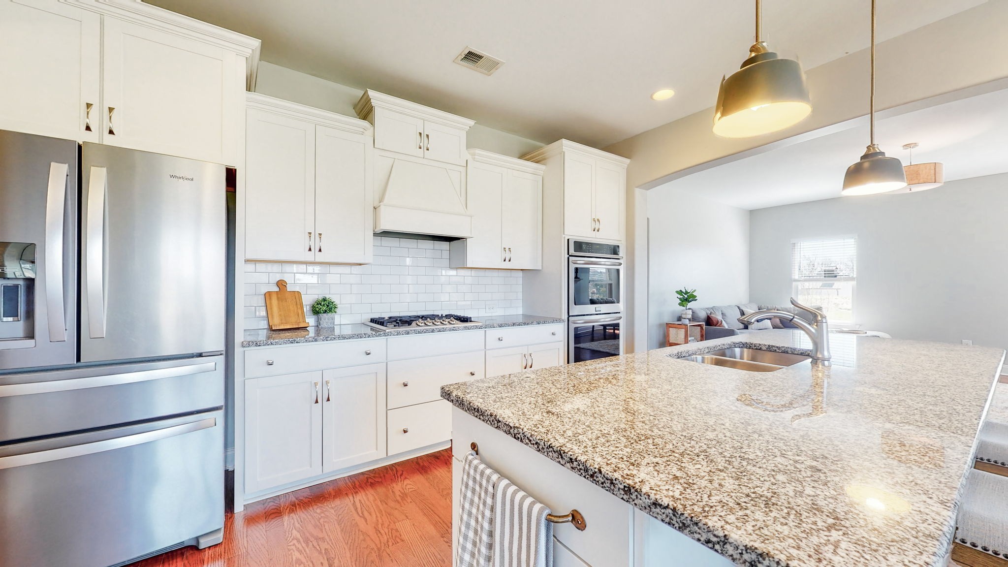 123 Monarchos Drive Gallatin, TN 37066 - Photo 9 of 55 a kitchen with granite countertop a sink stove and refrigerator