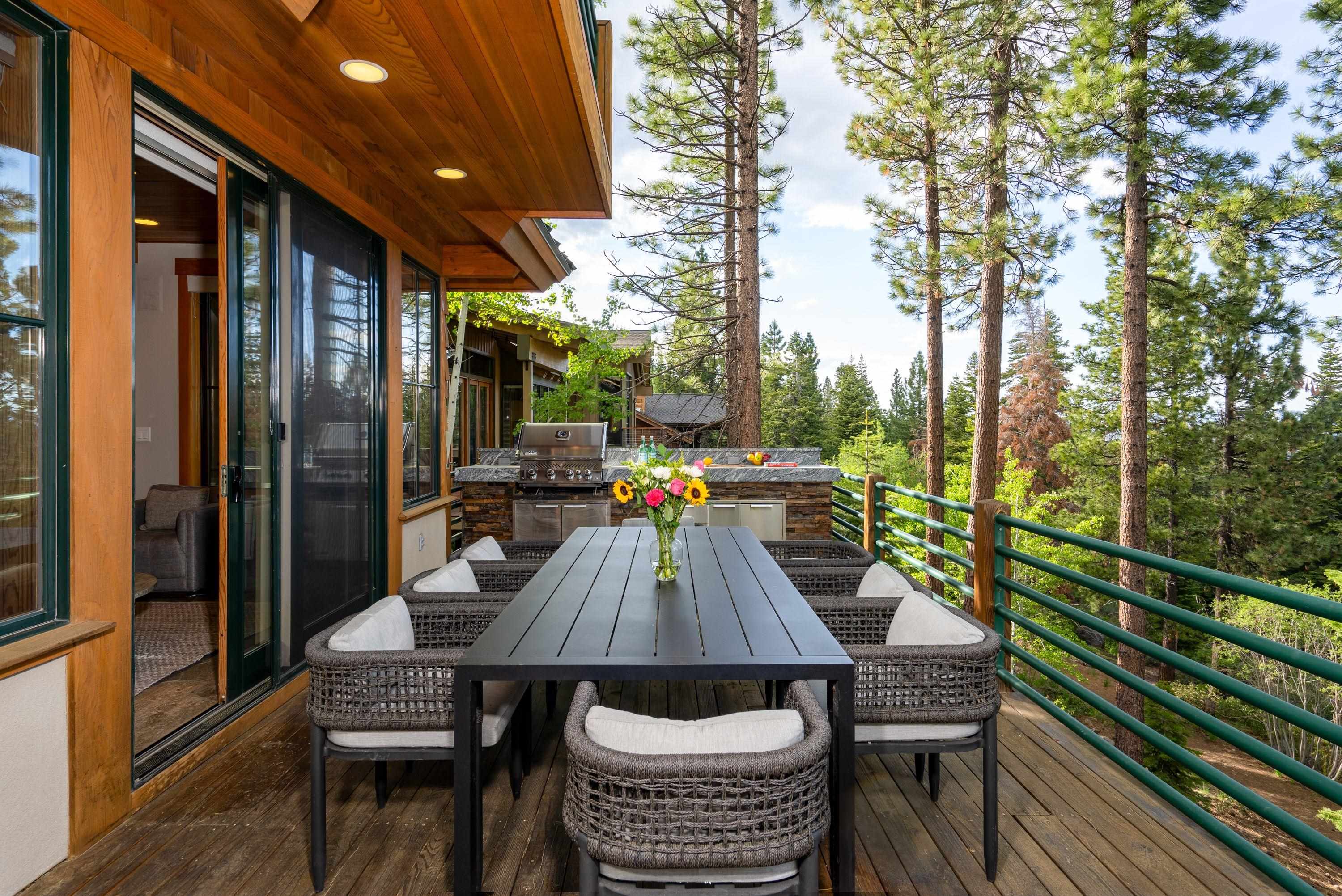 1723 Grouse Ridge Road Truckee, CA 96161 - Photo 22 of 27 a view of a patio with table and chairs and wooden floor