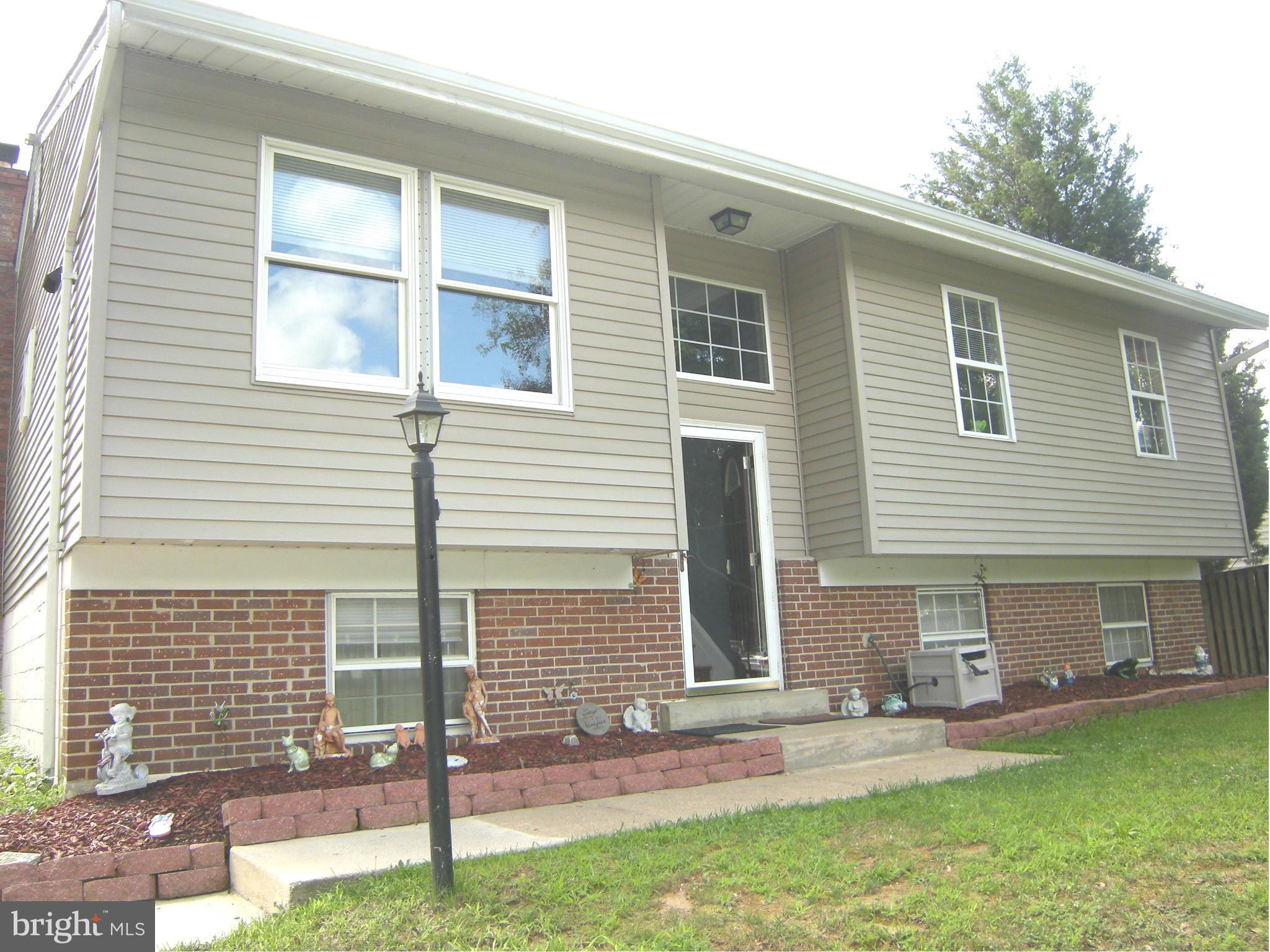 3067 Perch Drive Riva, MD 21140 - Photo 1 of 28 a front view of a house with a yard and garage