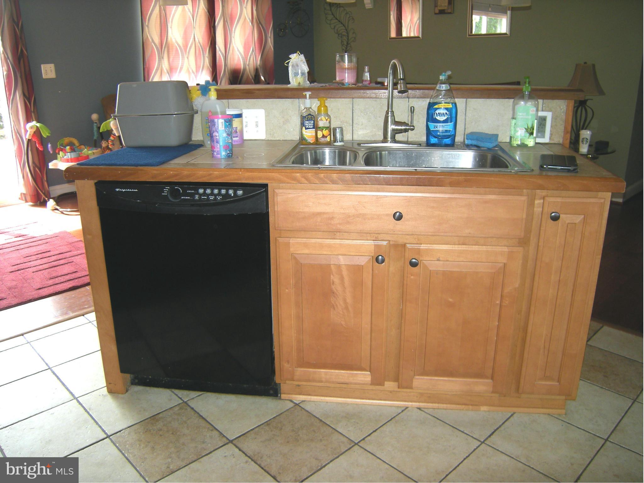 3067 Perch Drive Riva, MD 21140 - Photo 12 of 28 a kitchen with granite countertop a refrigerator and a sink