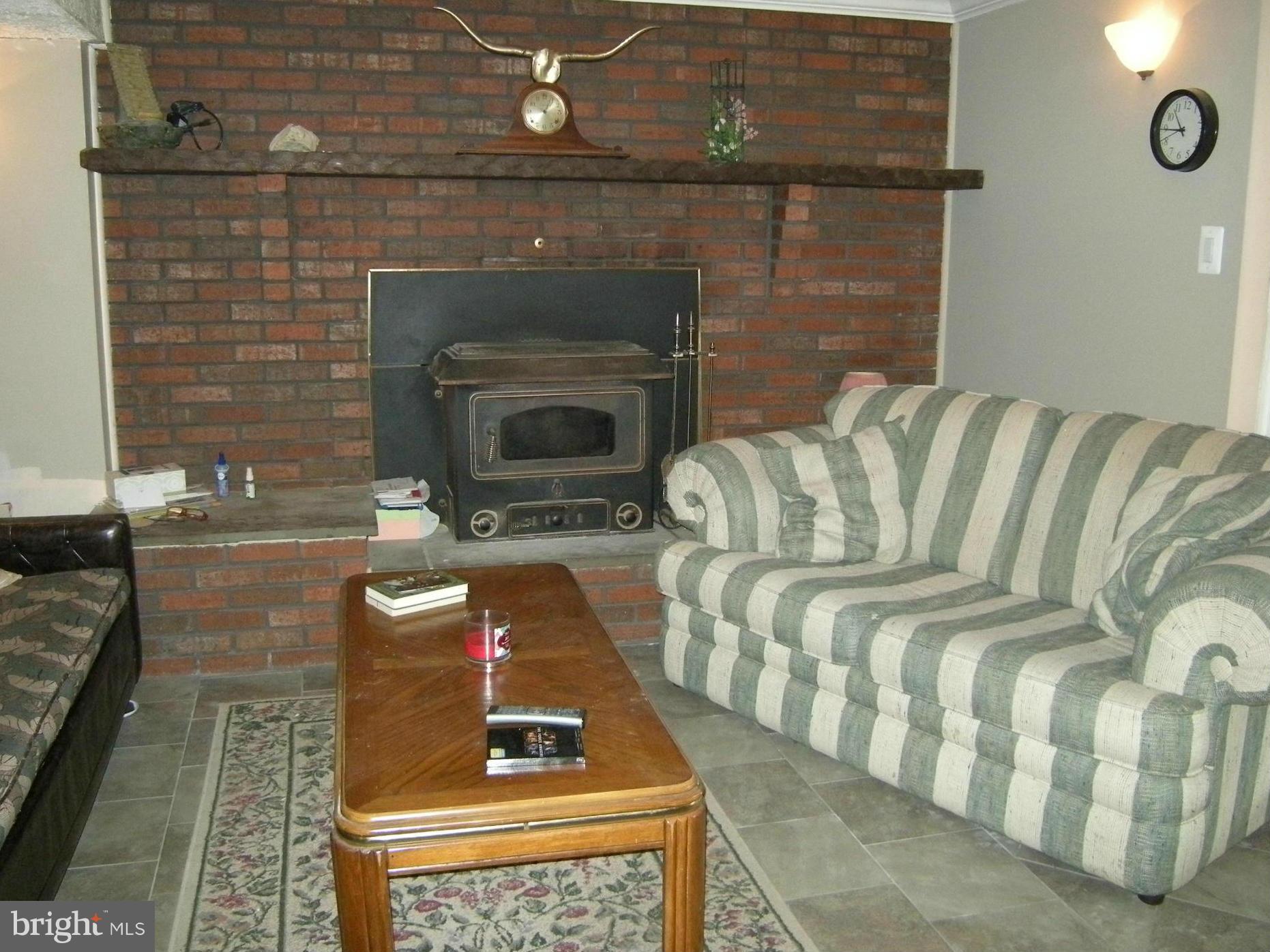 3067 Perch Drive Riva, MD 21140 - Photo 20 of 28 a living room with furniture and a fireplace