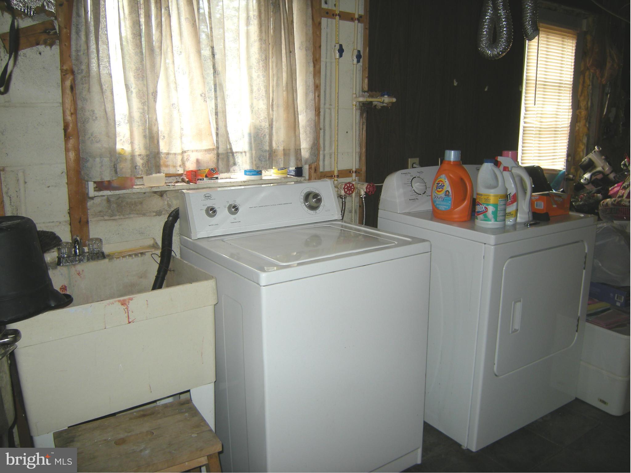 3067 Perch Drive Riva, MD 21140 - Photo 24 of 28 a view of washer and dryer with bathroom in the background