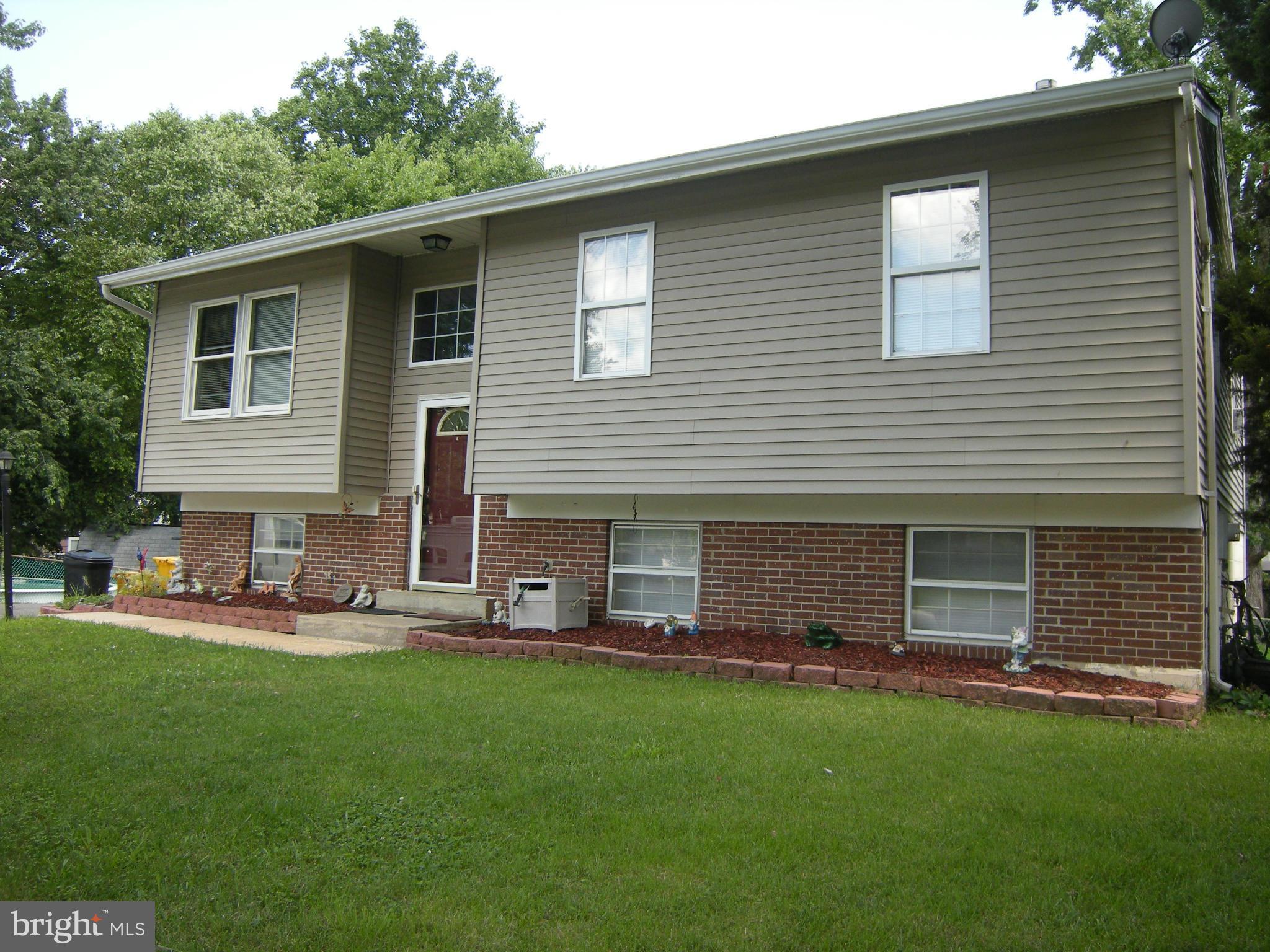 3067 Perch Drive Riva, MD 21140 - Photo 25 of 28 a front view of house with yard and outdoor seating