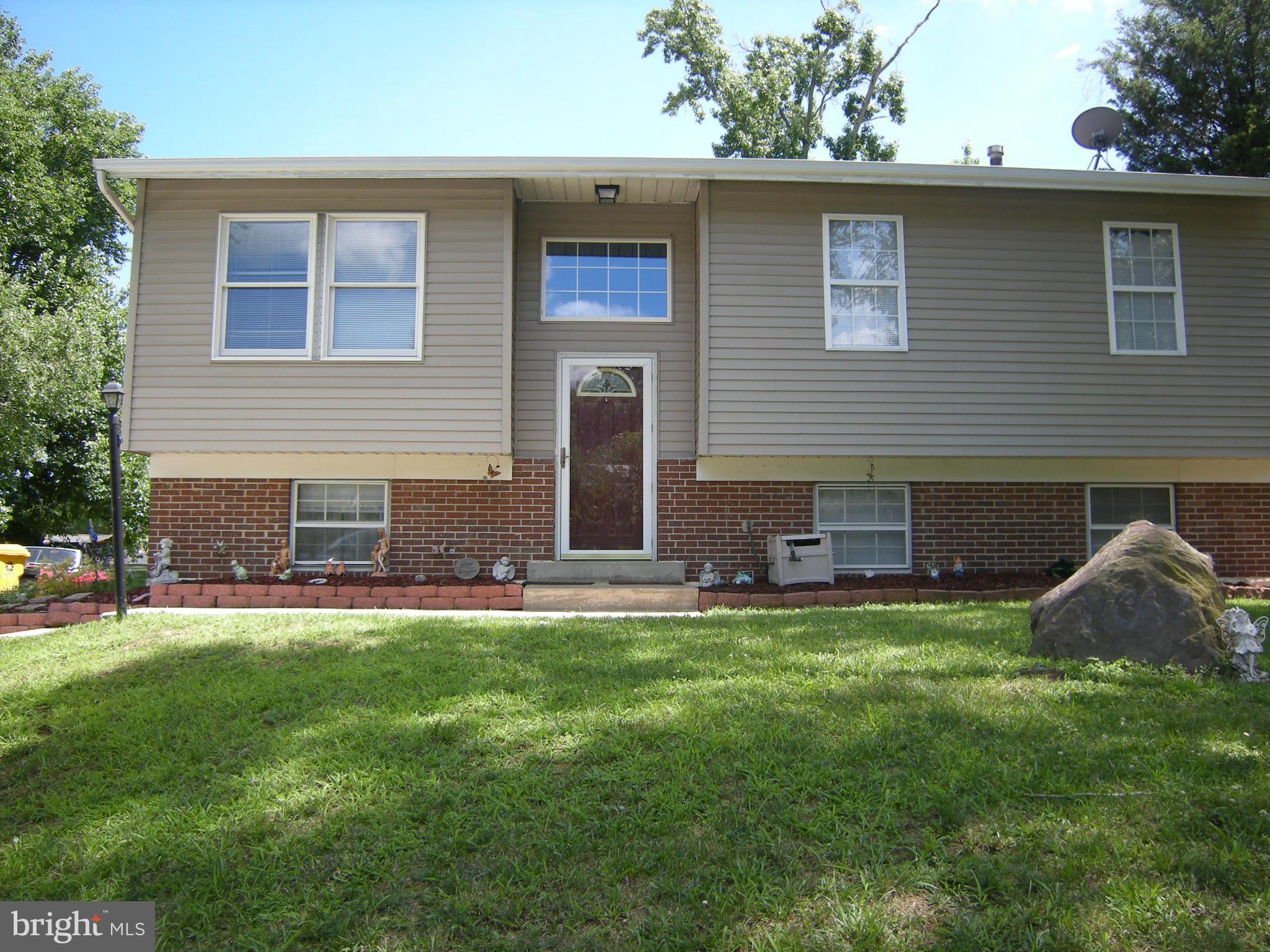 3067 Perch Drive Riva, MD 21140 - Photo 26 of 28 a backyard of a house with table and chairs